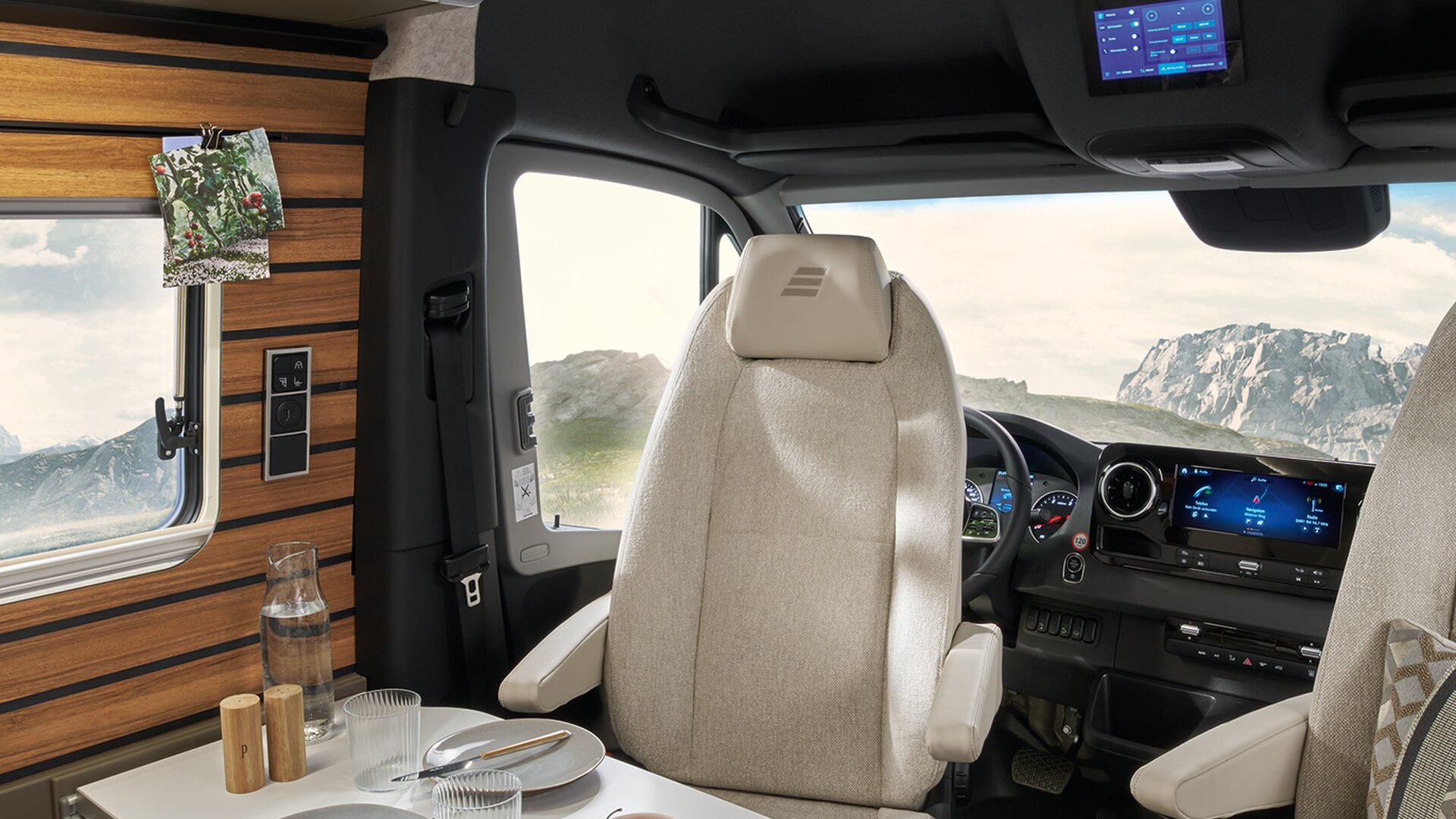 The HYMER Connect display inside the HYMER Grand Canyon S is centrally positioned facing the living area above the driver's seats.