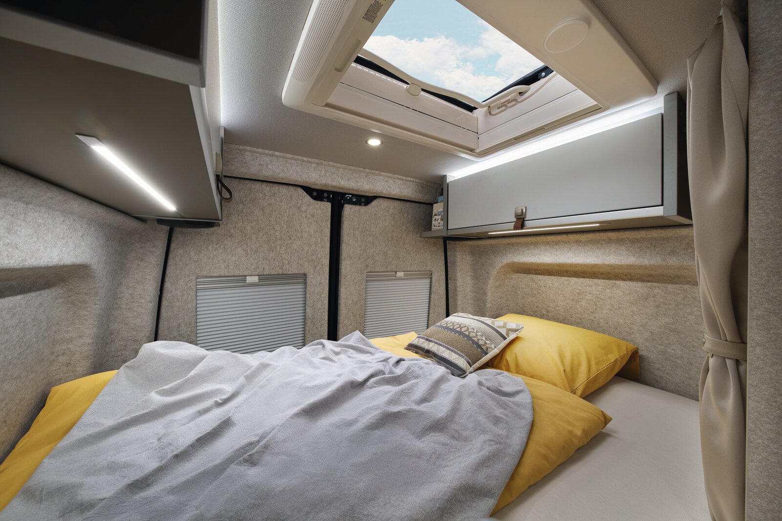 The skylight above the rear bed offers an unobstructed view of the starry night sky.