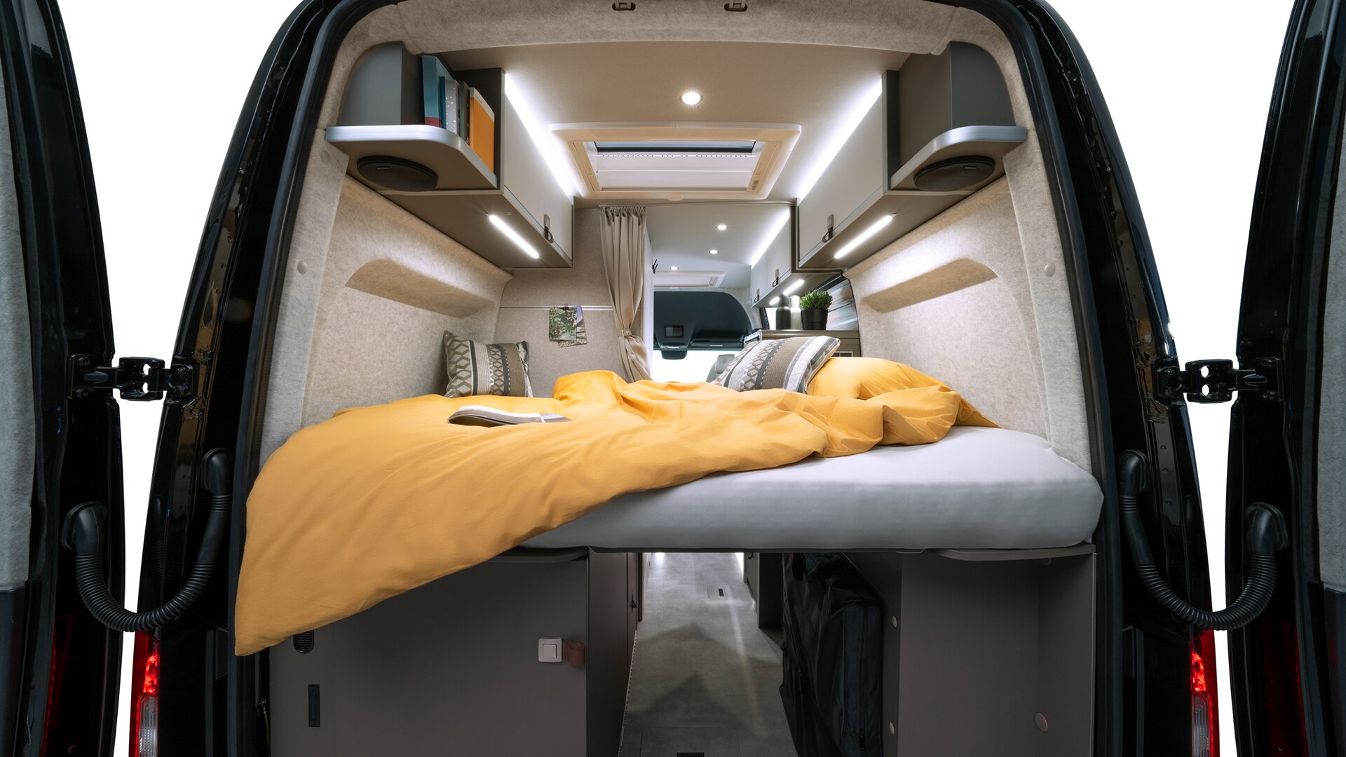 In the evening, unroll the mattress and make the most of the large bed at the rear of the camper van.