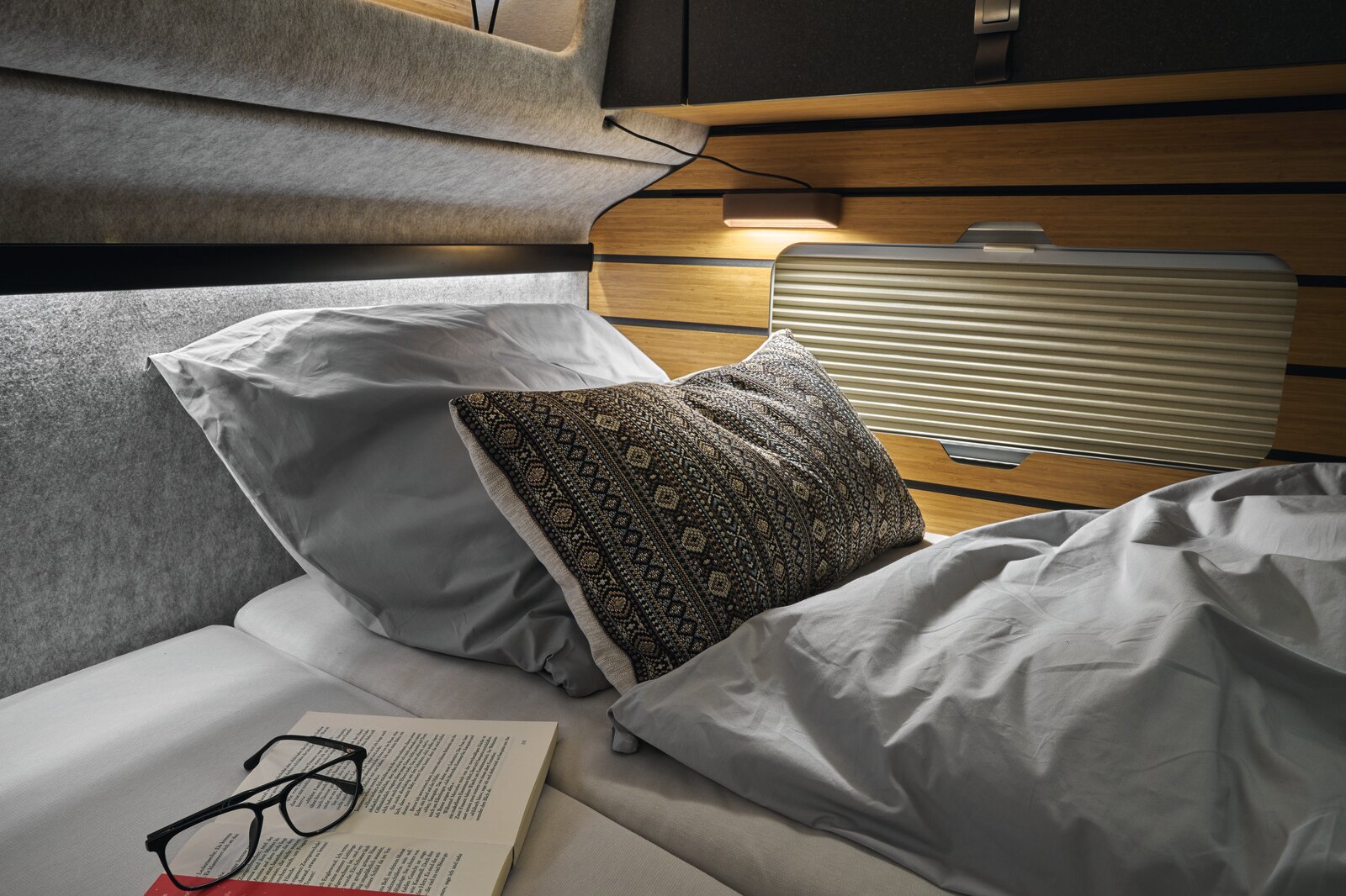 You no longer run the risk of bumping your head thanks to the redesigned overhead lockers at the head of the bed.