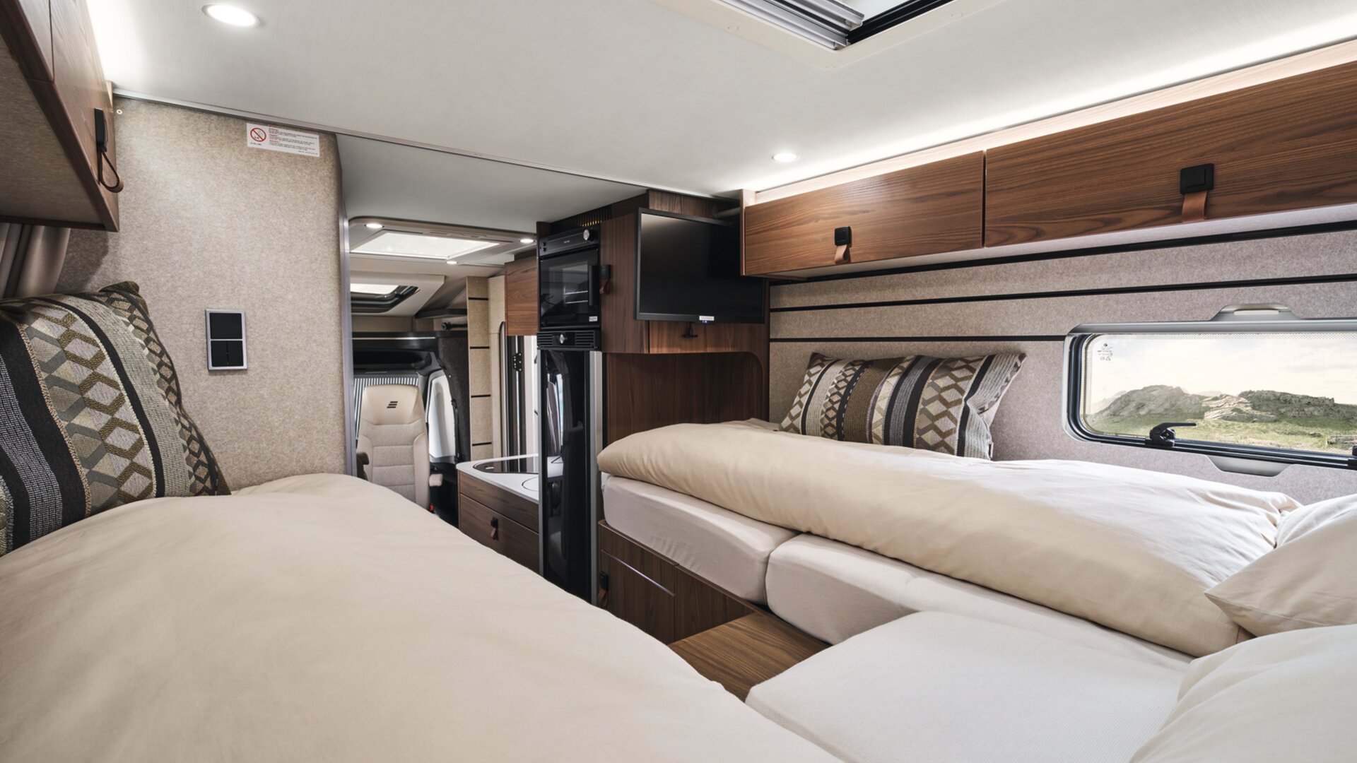 The clever design of the cabinets at the foot of the beds gives you plenty of legroom.