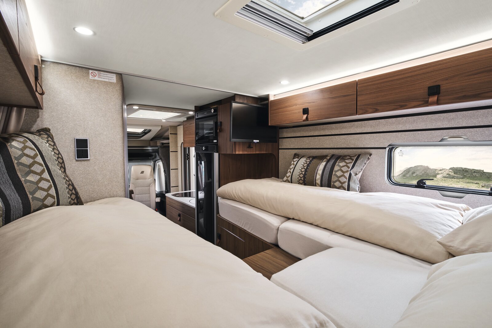 The clever design of the cabinets at the foot of the beds gives you plenty of legroom.