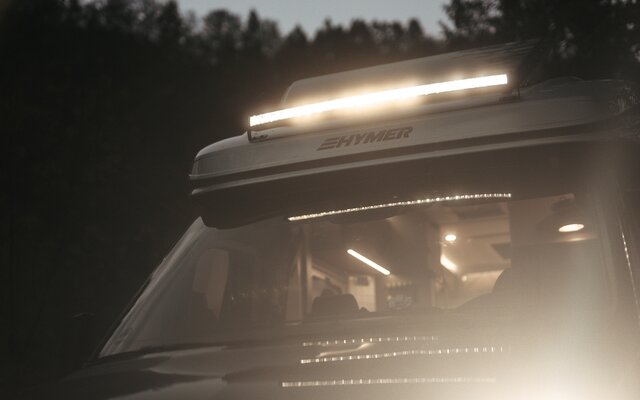 Light bar on a motorhome above the windscreen, it is lit because it is dark