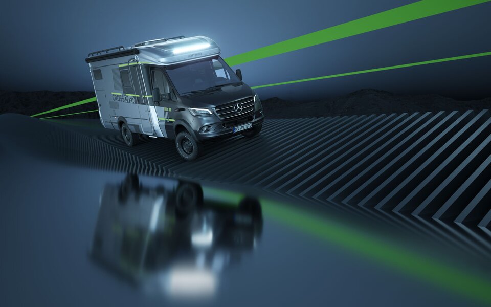 Sporty, semi-integrated Mercedes motorhome with CrossOver decals driving on a bluish-grey, futuristic digital track reminiscent of a DNA chain. Two green stripes run along it. The motorhome is faintly reflected on the surface next to the track.	