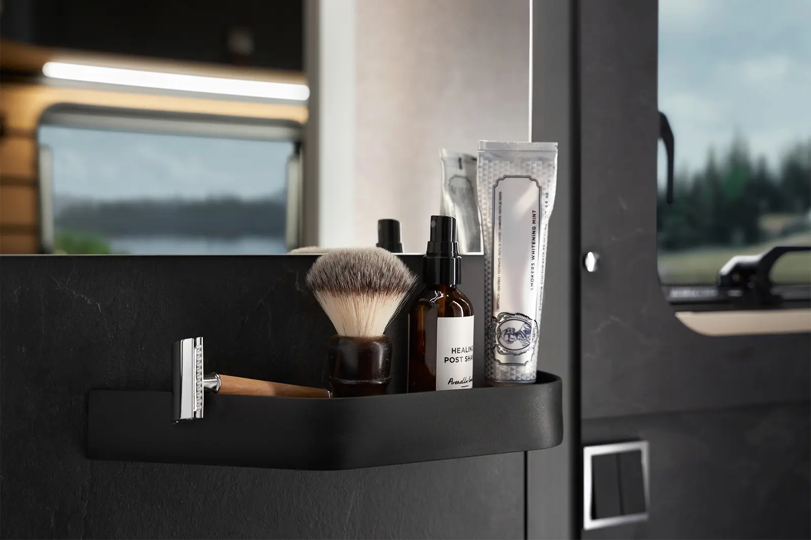 Next to the mirror in the Vario Spa of the HYMER Venture S, there is space for shaving utensils.