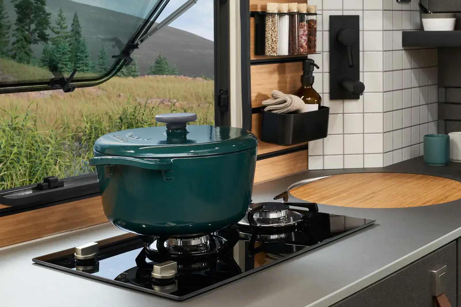 A pot sits on the gas hob in the HYMER Venture S.