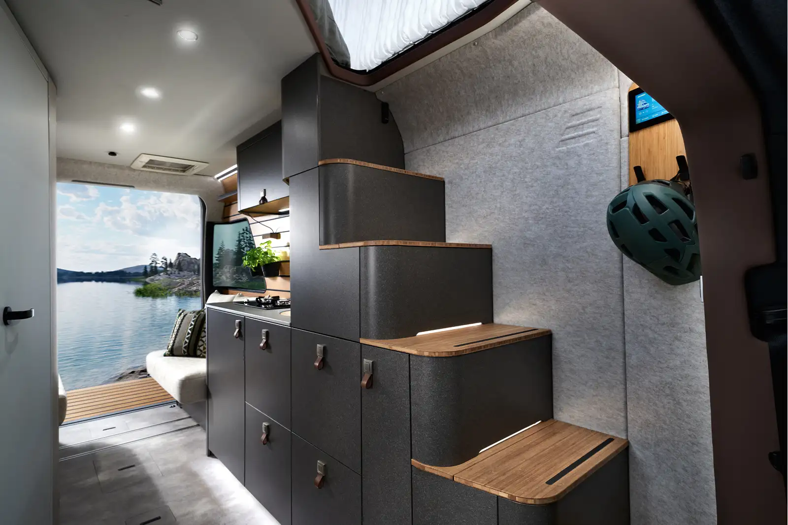 The comfort stairs of the HYMER Venture S with illuminated steps lead up to the Instant Loft.